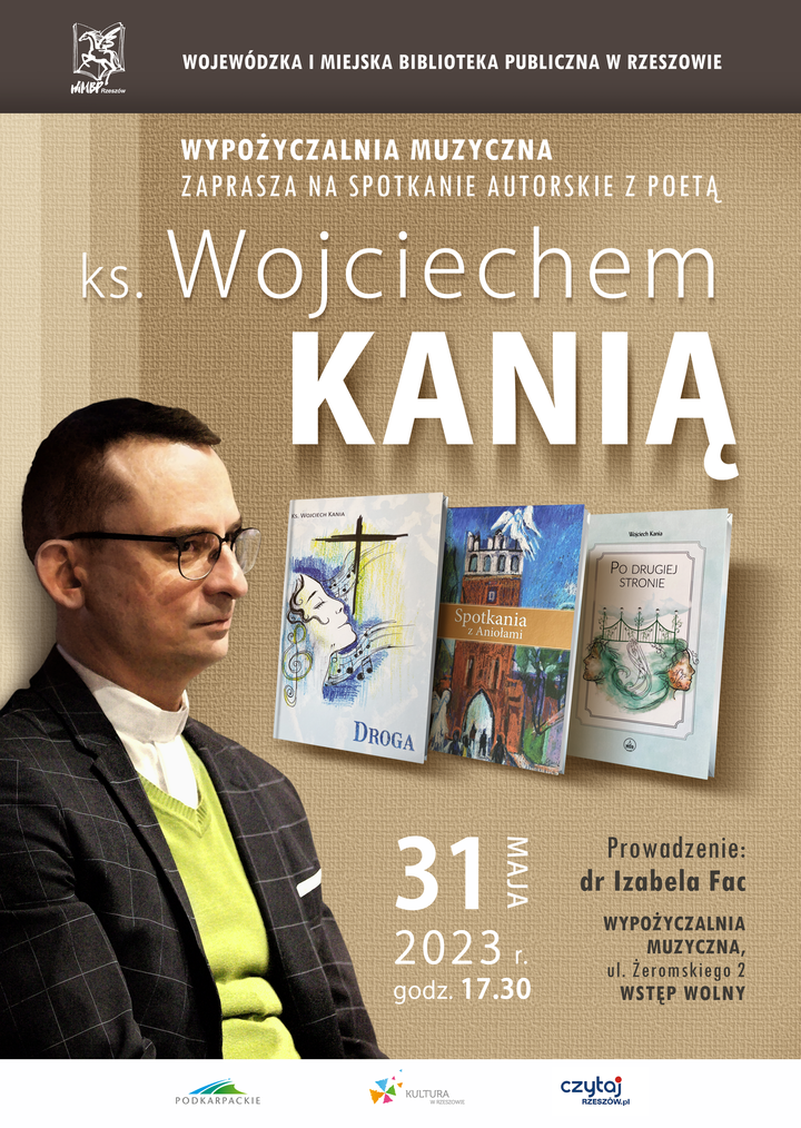 Ksiądz w okularach, seledynowym swetrze i marynarce. Obok trzy książki "Droga", "Spotkania z Aniołami" i "Po drugiej stronie".