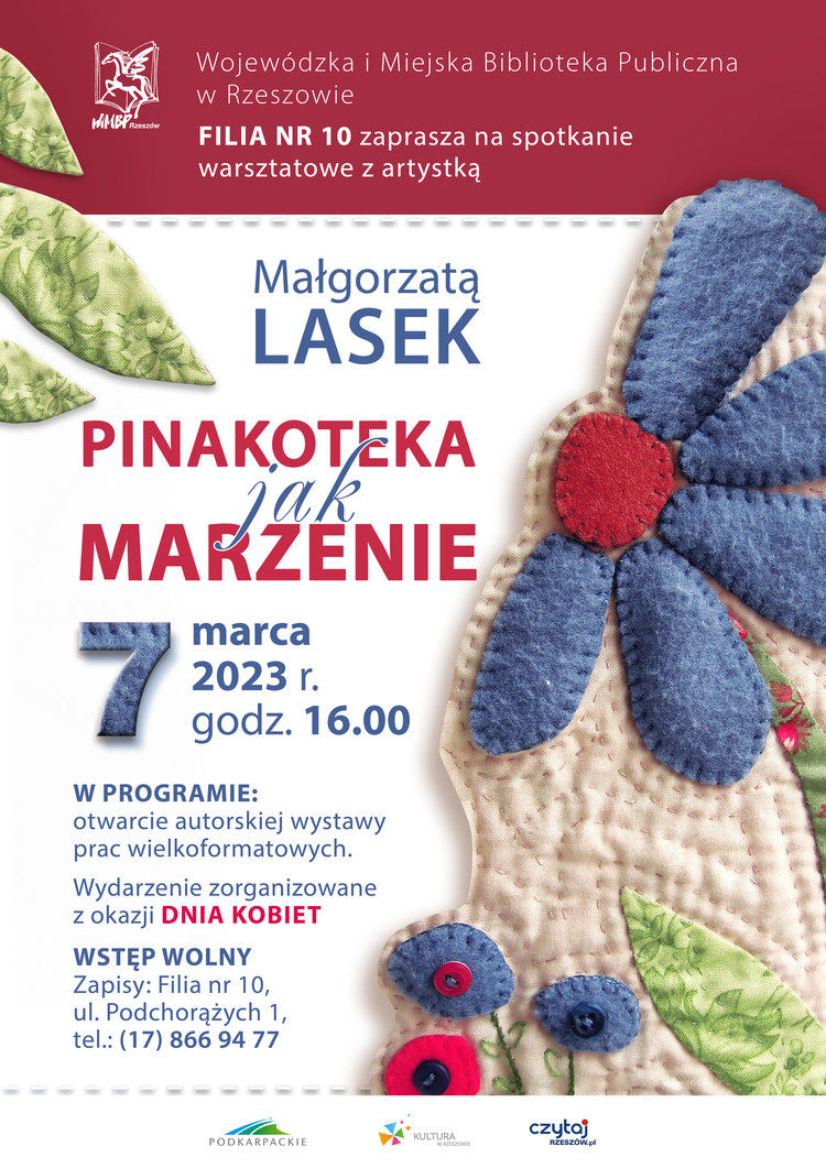 Fragment materiału w z naszytym wzorem kwiata.