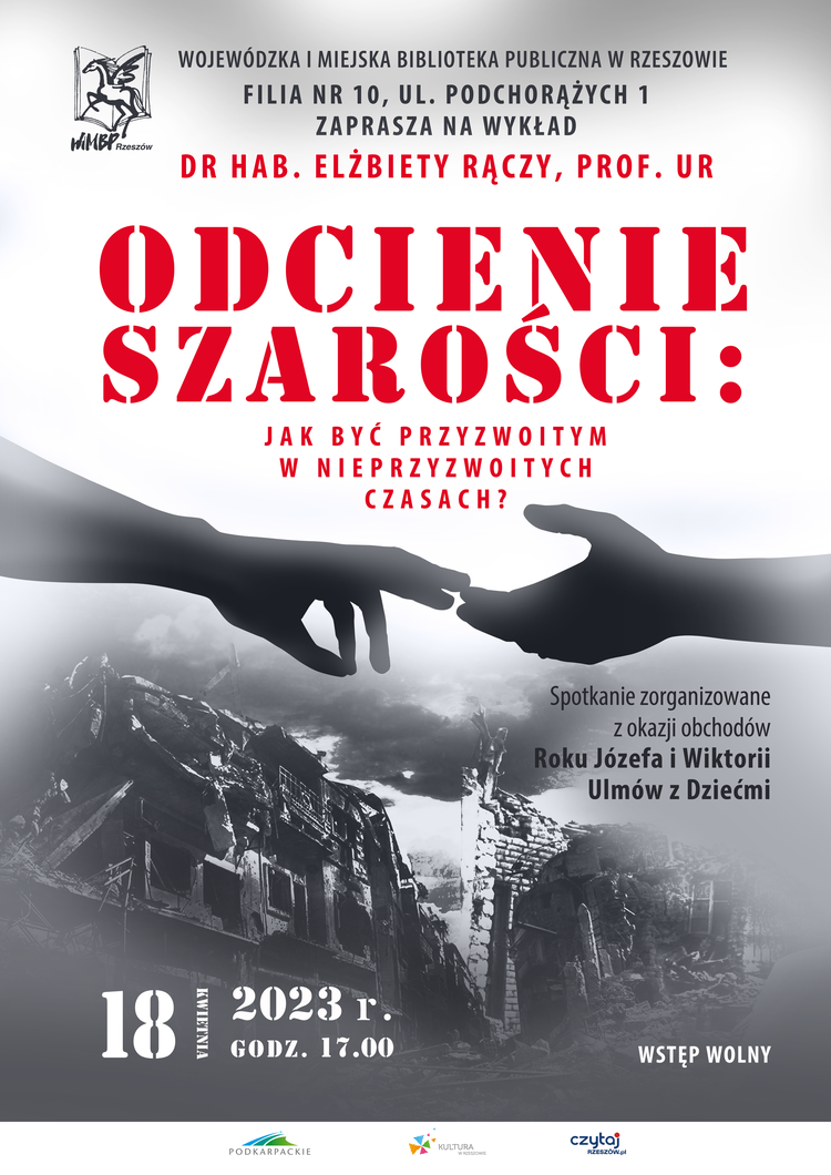 Dwie wyciągnięte do siebie dłonie, w tle ruiny budynku.