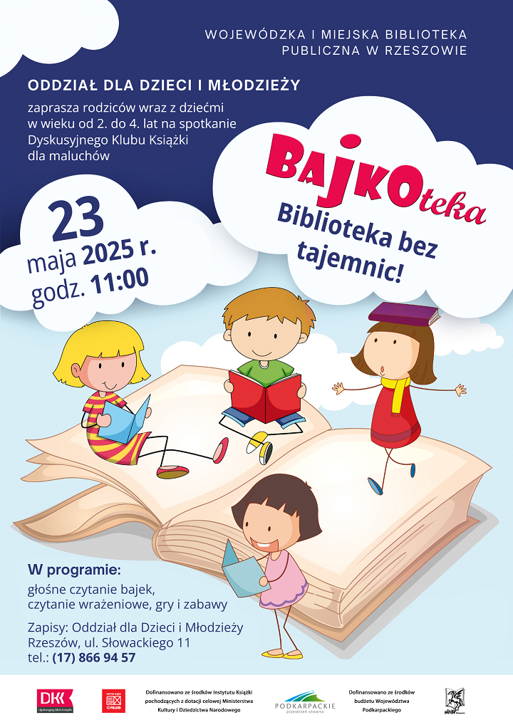 Czwórka dzieci siedzących na książce. 
