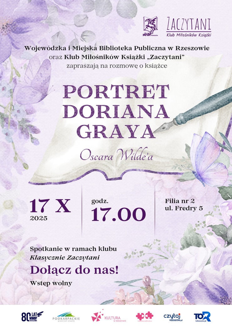 Otwarta książka, pióro, motyle i kwiaty