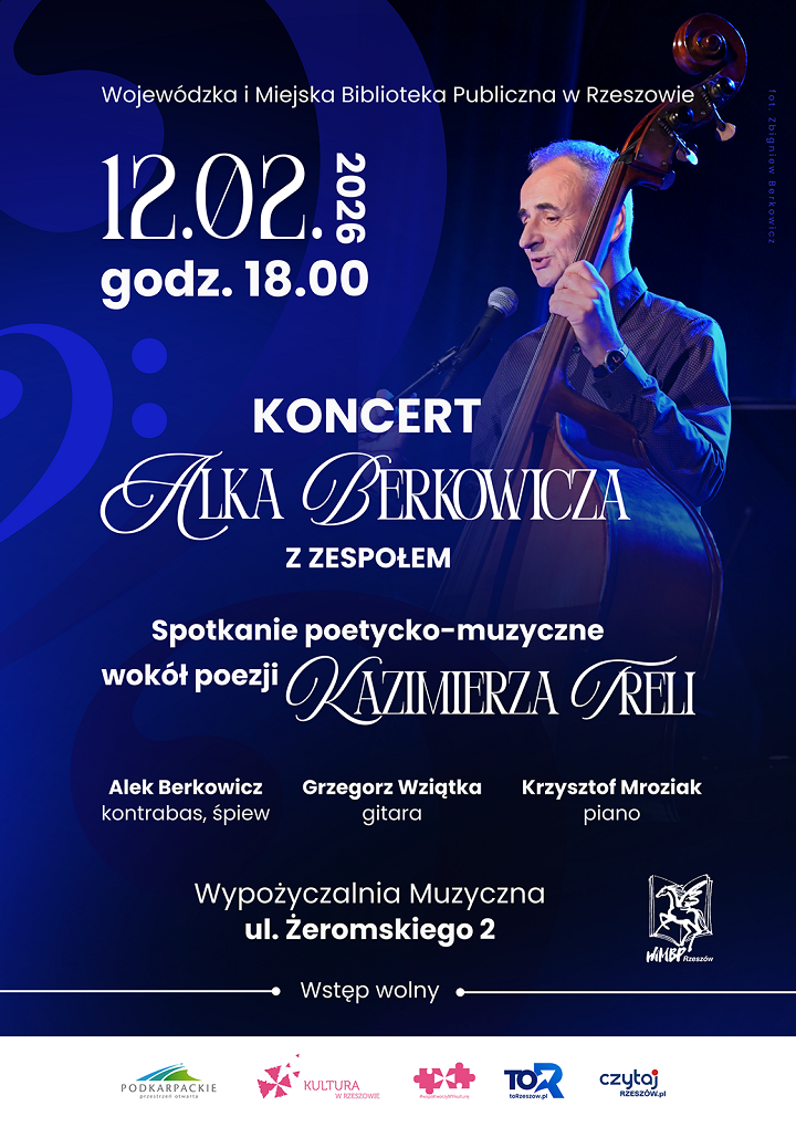 Mężczyzna z&nbsp;kontrabasem w&nbsp;świetle reflektor&oacute;w scenicznych