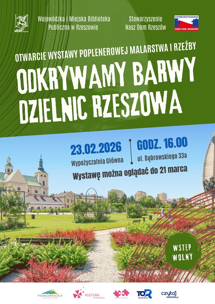 Widok na&nbsp;Ogrody bernardyńskie w&nbsp;Rzeszowie, trawa krzewy, w&nbsp;tle budynki i&nbsp;bloki